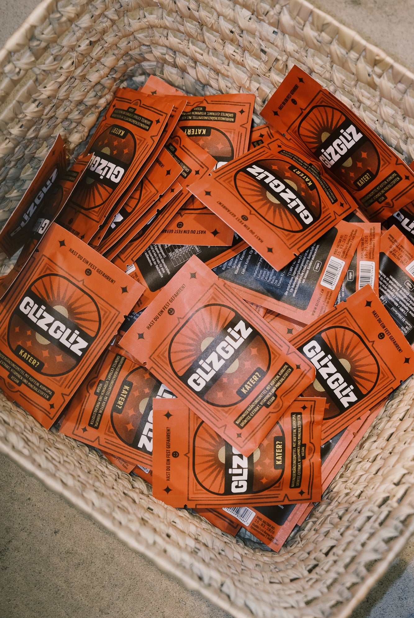 Multiple packages of Glizgliz on a textured surface