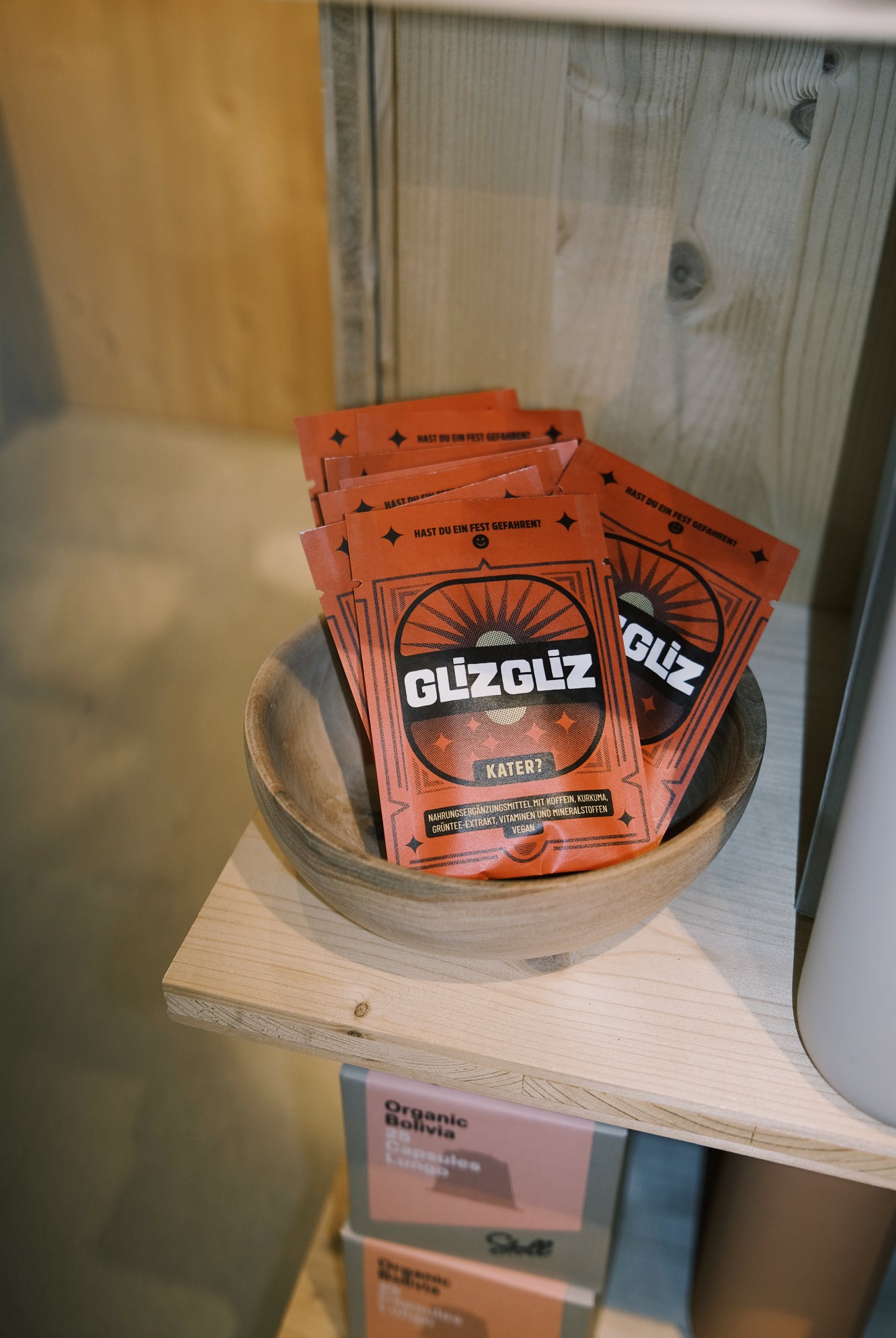 Glizgliz package in a bowl on a wooden shelf