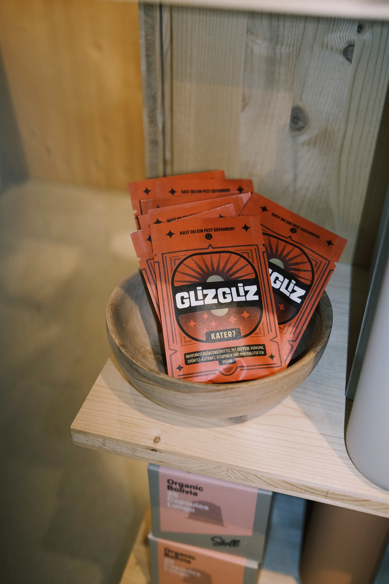 Glizgliz package in a bowl on a wooden shelf
