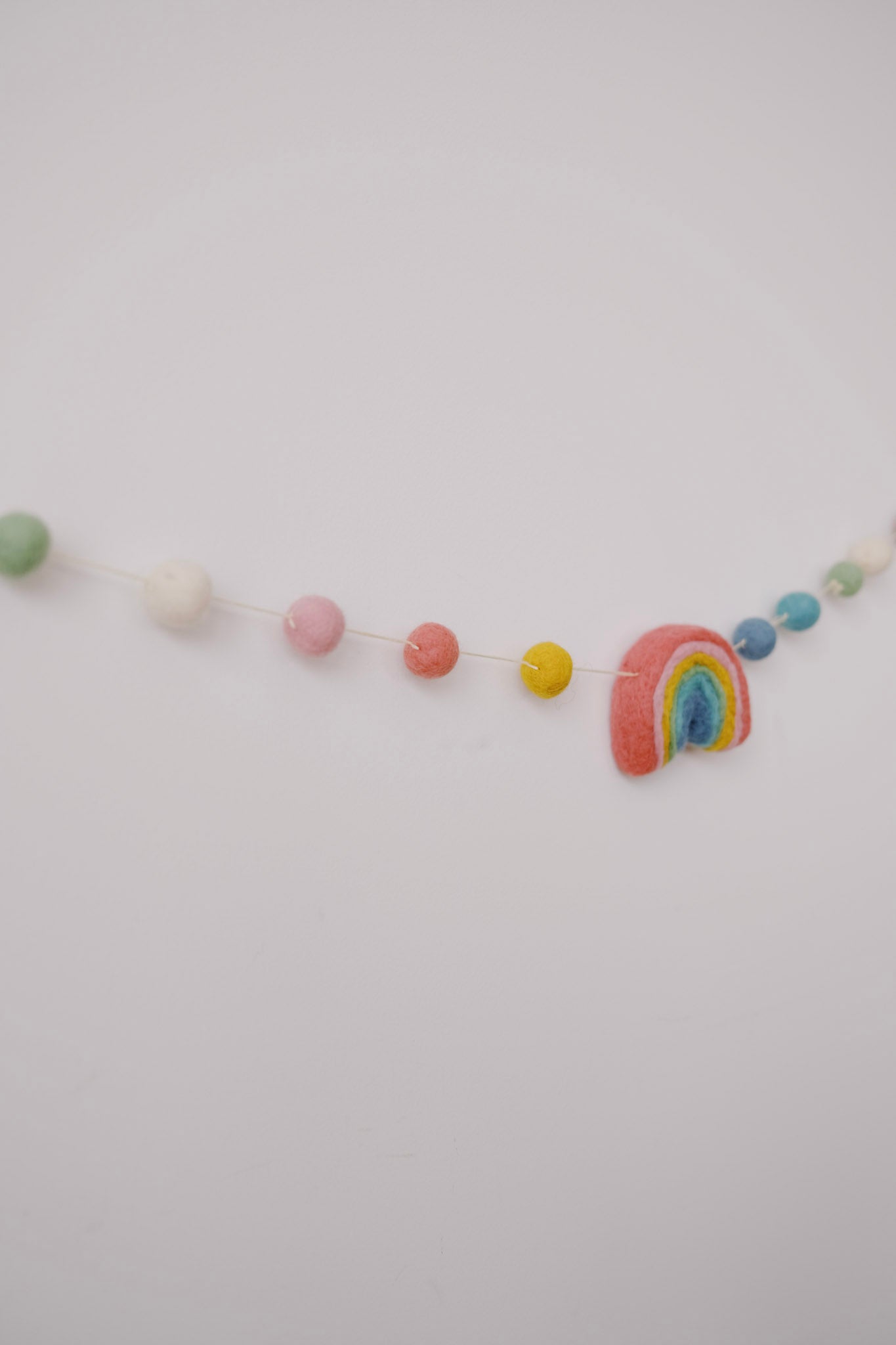 felt garland - rainbow pompoms - collab zürich