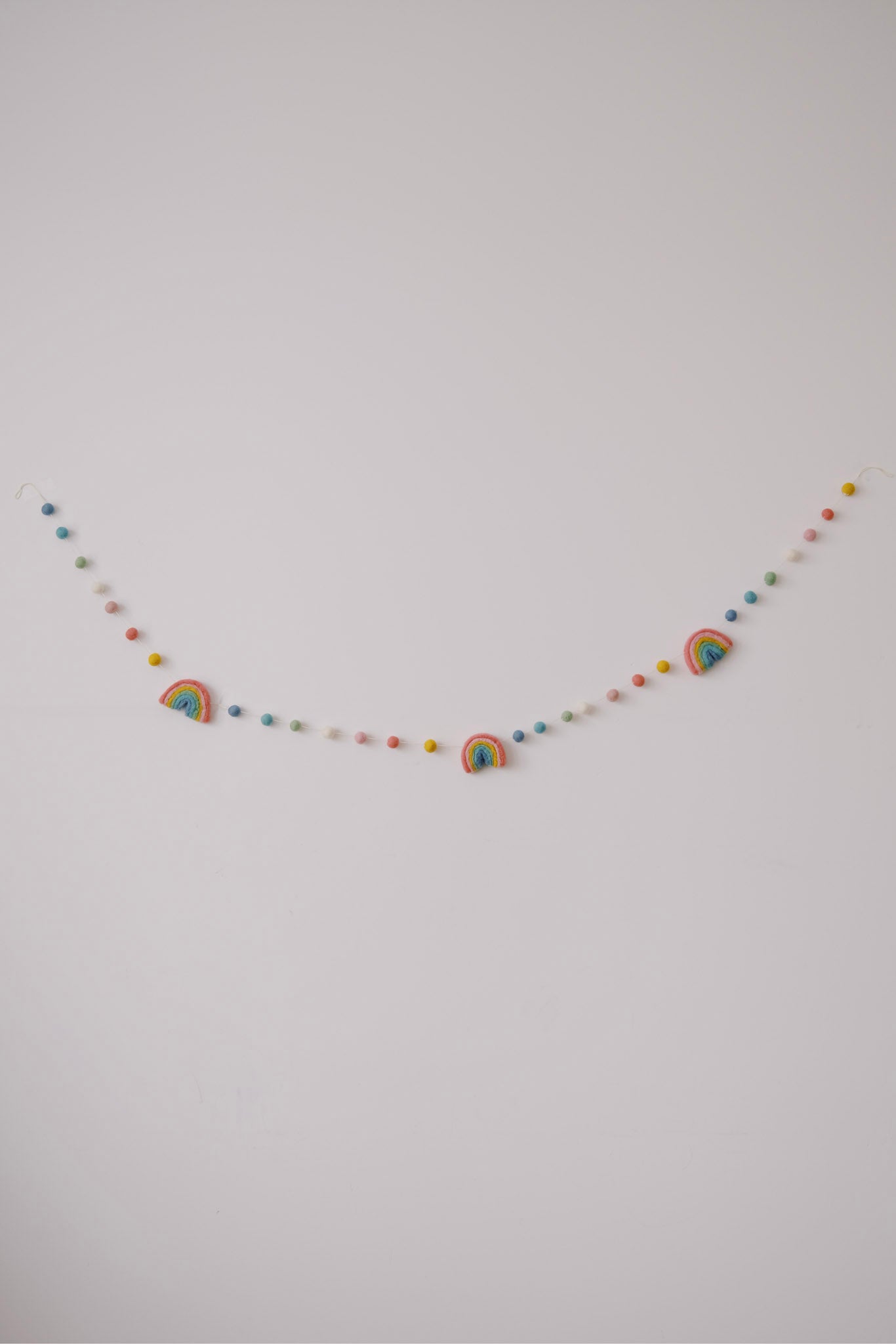 felt garland - rainbow pompoms - collab zürich