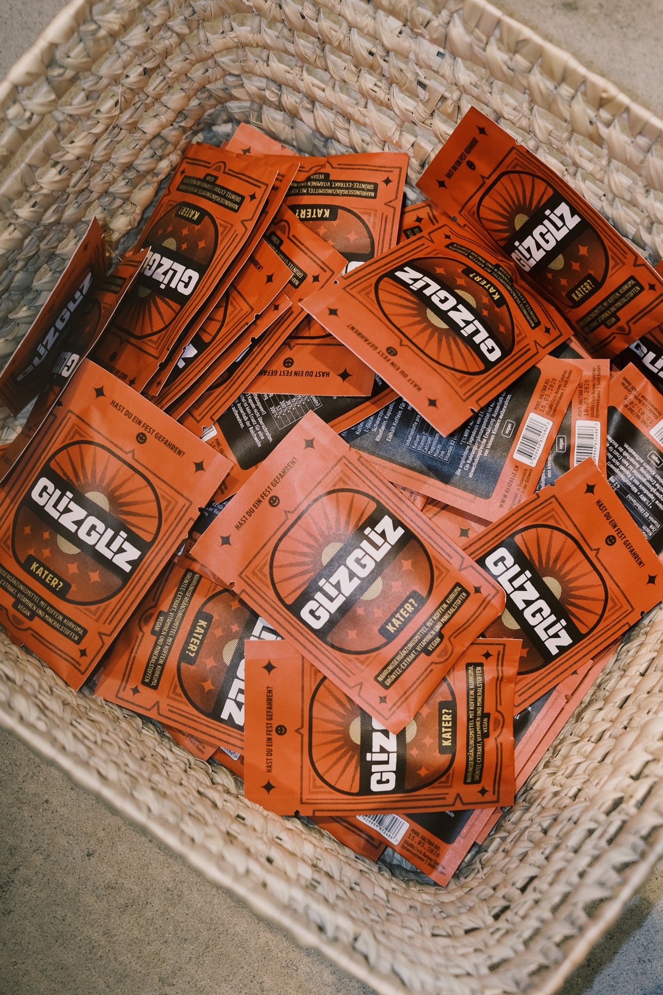 Multiple packages of Glizgliz on a textured surface