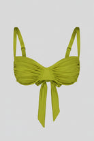 Light green bikini top with a bow detail on a white background