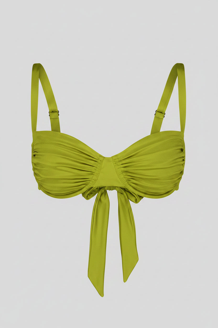 Light green bikini top with a bow detail on a white background