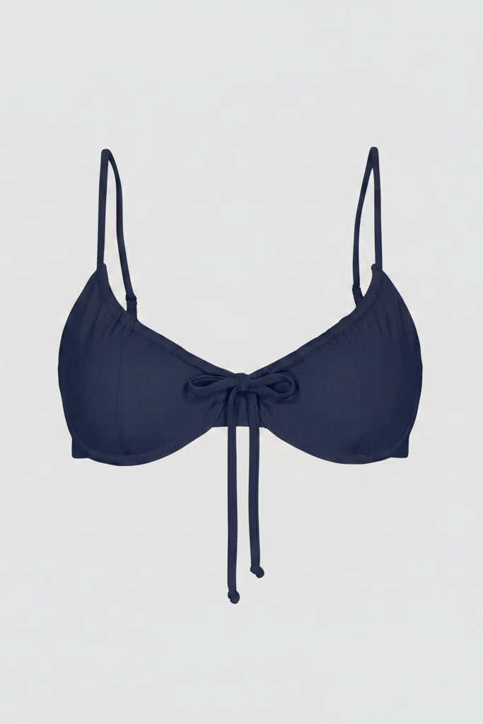 Navy blue bikini top with thin straps on a white background