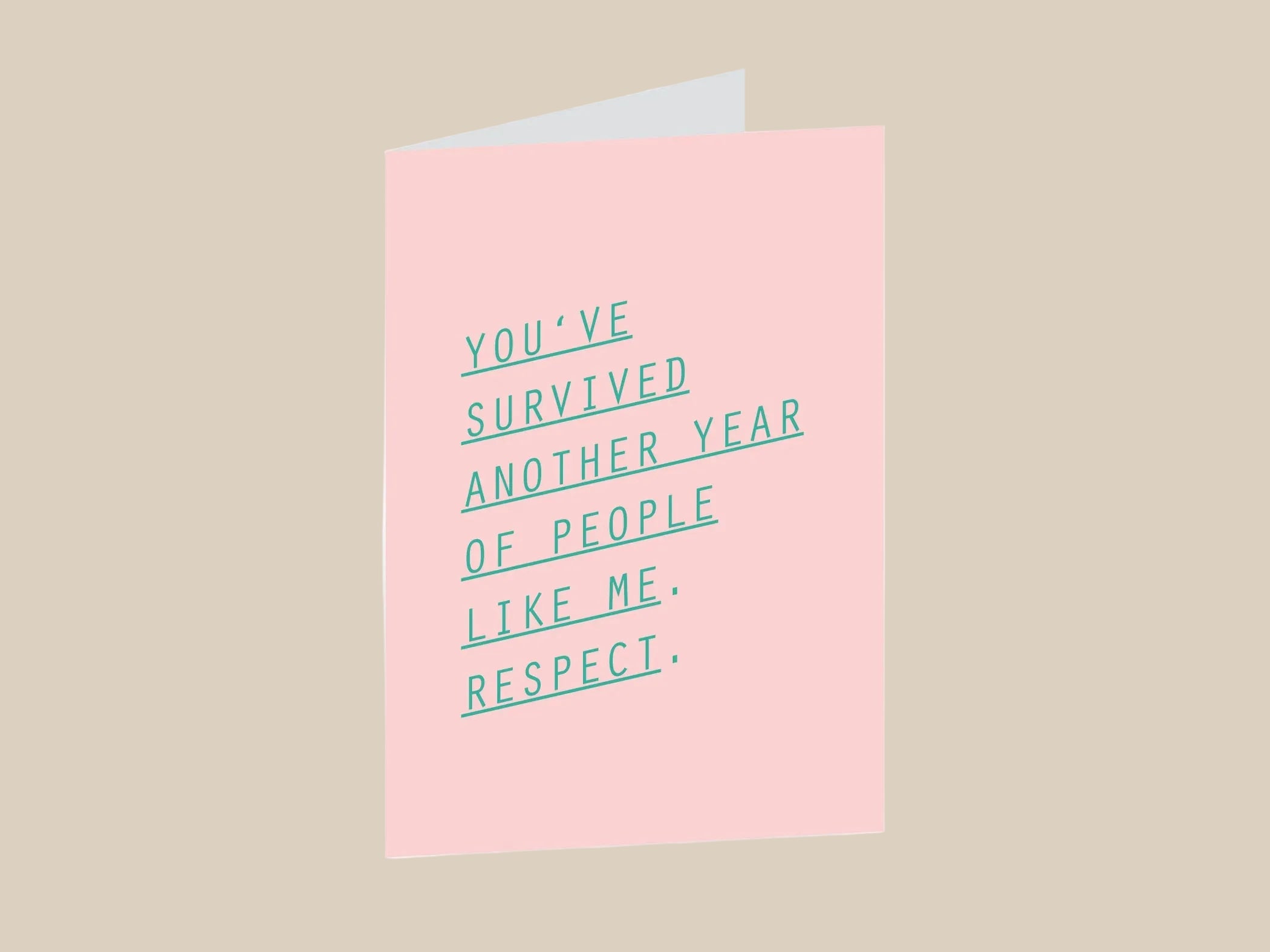 Pink greeting card with green text on a white background